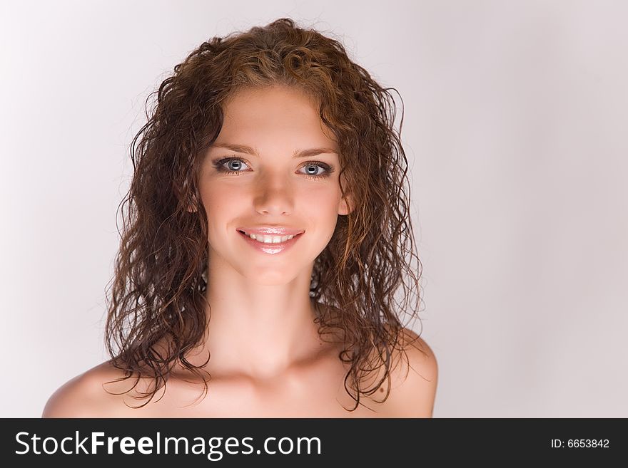 Smiling young girl isolated in studio