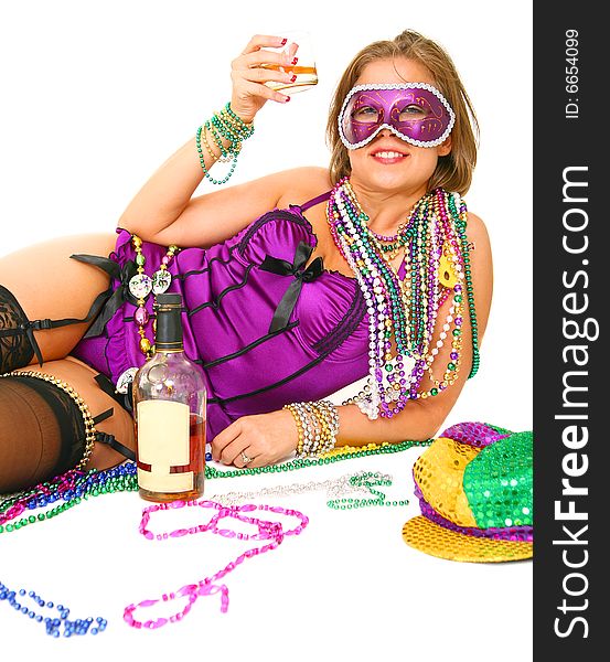 Young and beautiful caucasian in colorful mardi gras dress wearing a lot of beads and holding a glass of drink. Young and beautiful caucasian in colorful mardi gras dress wearing a lot of beads and holding a glass of drink