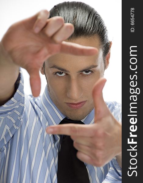 Businessman making frame with hand gesture on an isolated white background