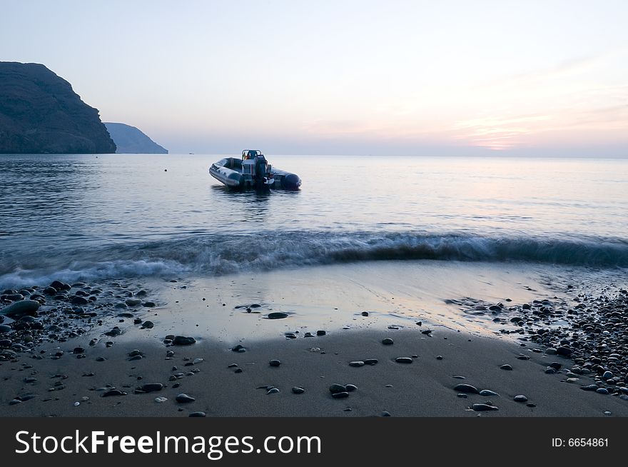 Lonely boat in a bay by the sunrise. Lonely boat in a bay by the sunrise