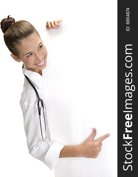 A smiling lady doctor indicating to the placard