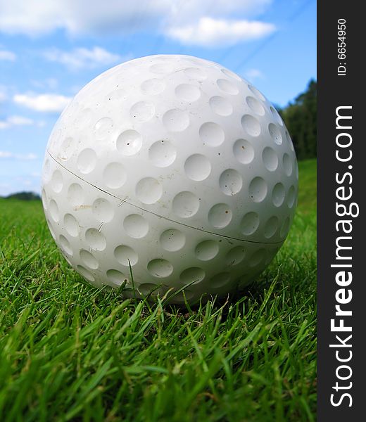 Golf ball on green grass