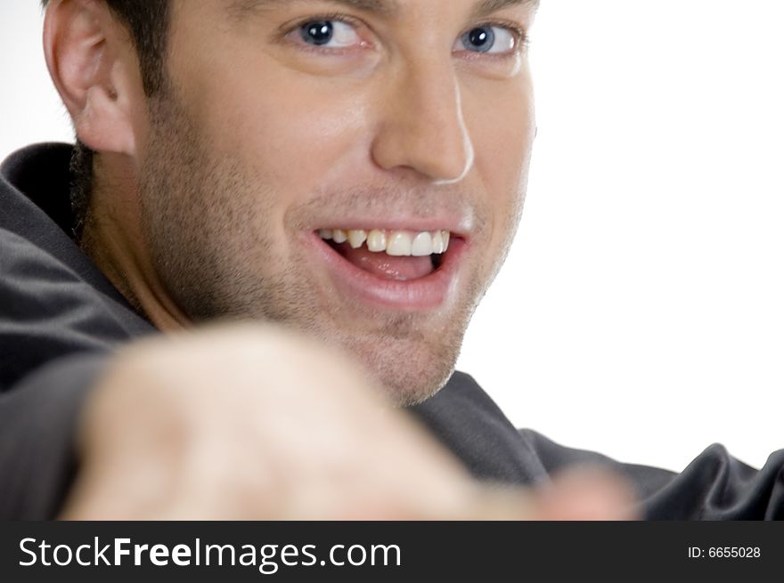 Happy man looking at camera against white background