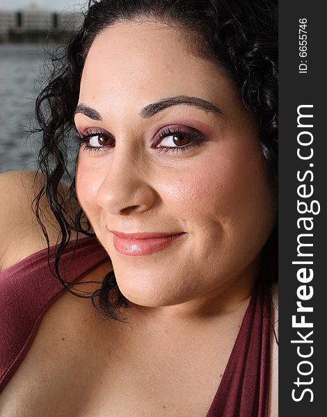 Headshot of a beautiful young woman smiling.