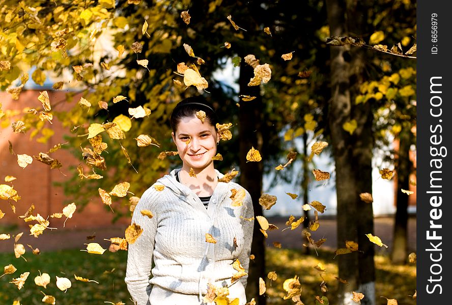 Woman In Autumnal Leaves