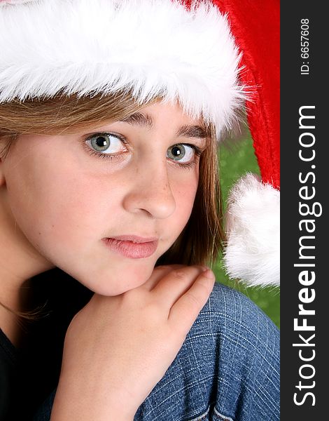 Beautiful teenager girl wearing a christmas hat. Beautiful teenager girl wearing a christmas hat