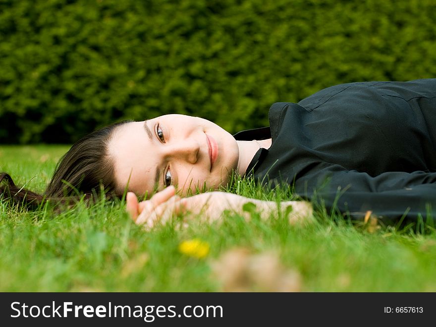 The young woman on the grass