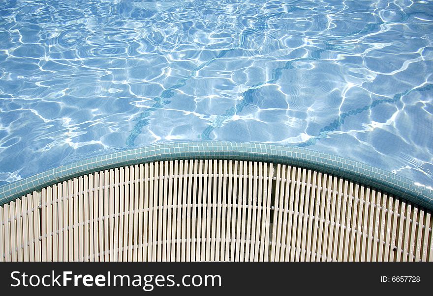 Swimming pool sun reflections and water overflow. Swimming pool sun reflections and water overflow