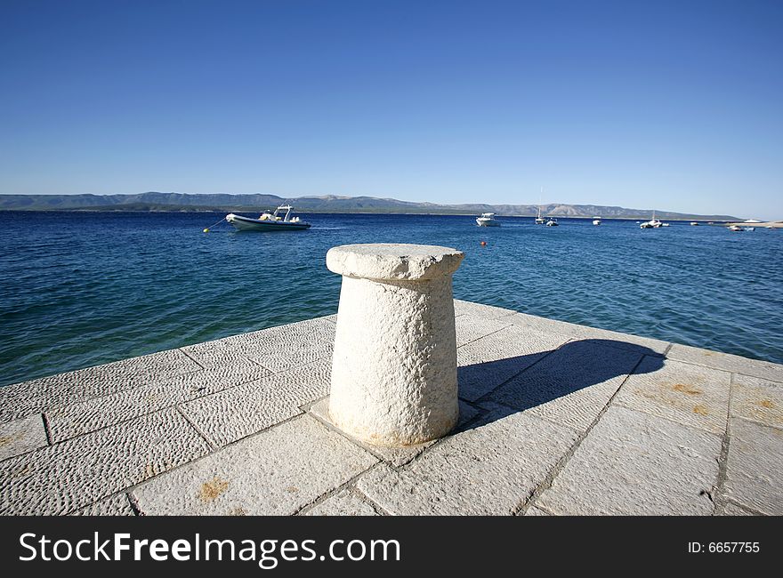 Rope-tie On Jetty In The Mediterranean Sea