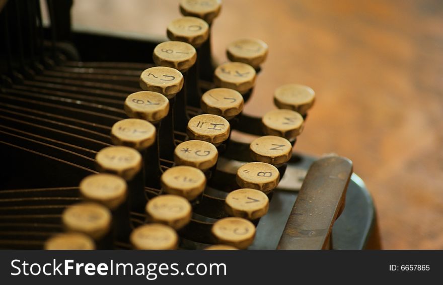 Closeup of the keys on an old typewriter in an antique setting. Closeup of the keys on an old typewriter in an antique setting.