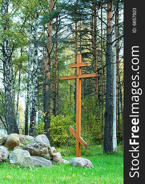 The wooden orthodoxy cross in the forest