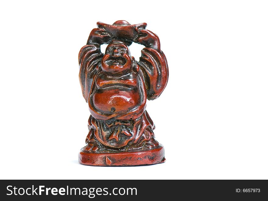 Brown statuette of east god from a stone on a white background