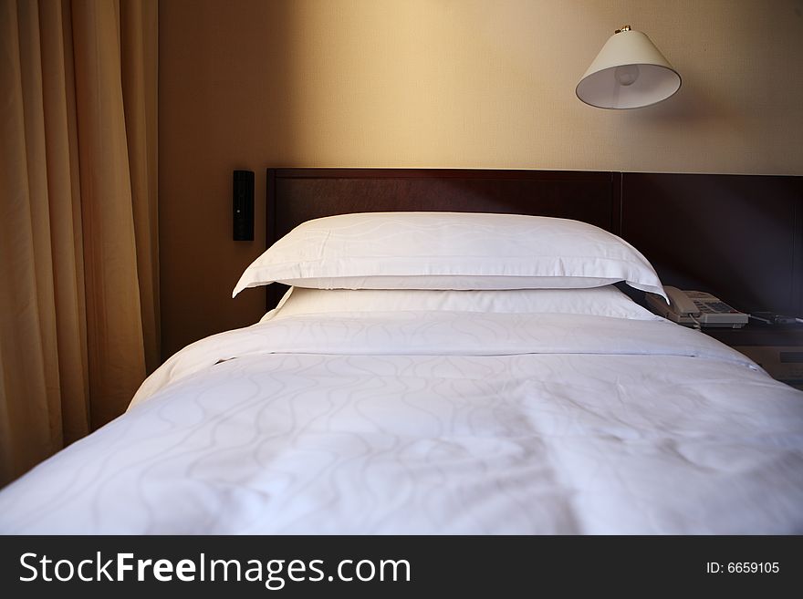 Bedroom with lamp bed and pillows. Bedroom with lamp bed and pillows