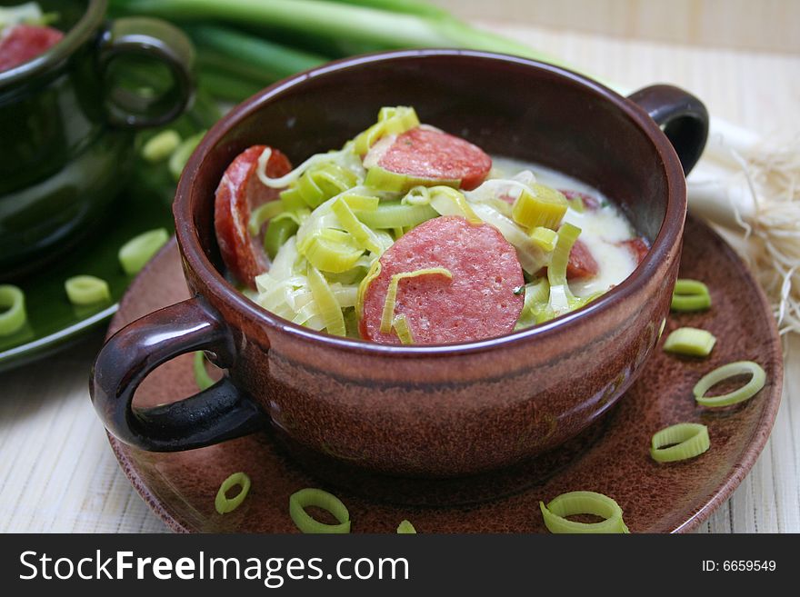 A fresh soup of green leak with sausages