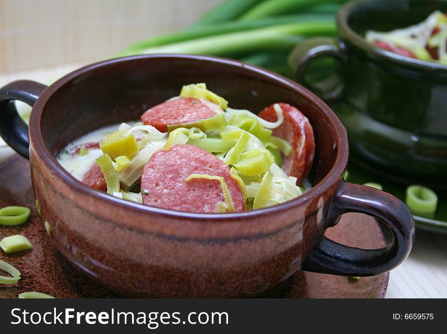 A fresh soup of green leak with sausages