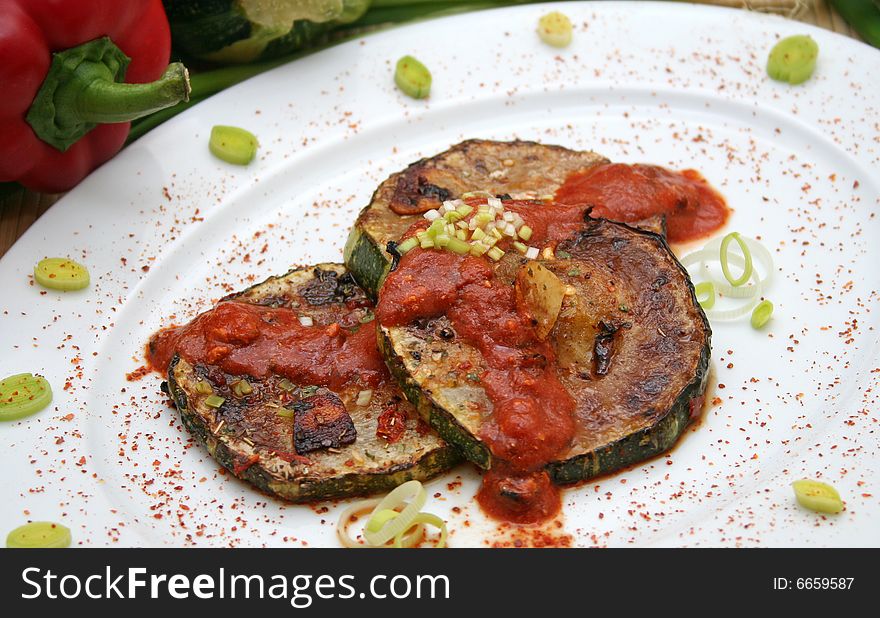 A vegetarian meal of fresh zucchinis with chili sauce