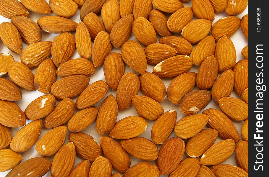 Close up fresh peeled almonds background