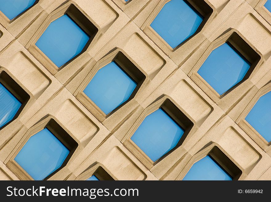 Facade of a modern office building with blue windows. Facade of a modern office building with blue windows