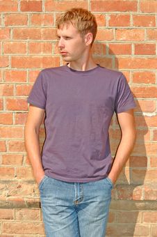 Young Stylish Man Stand Near Brick Wall. Royalty Free Stock Photography Young Stylish Man Stand Near Brick Wall. Royalty Free Stock Photography