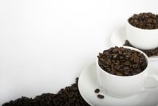 Two Coffee Cups With Coffee Beans Stock Photos