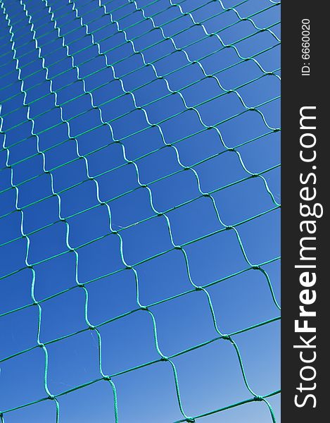 Nylon net pattern detail against a clear blue sky. Nylon net pattern detail against a clear blue sky