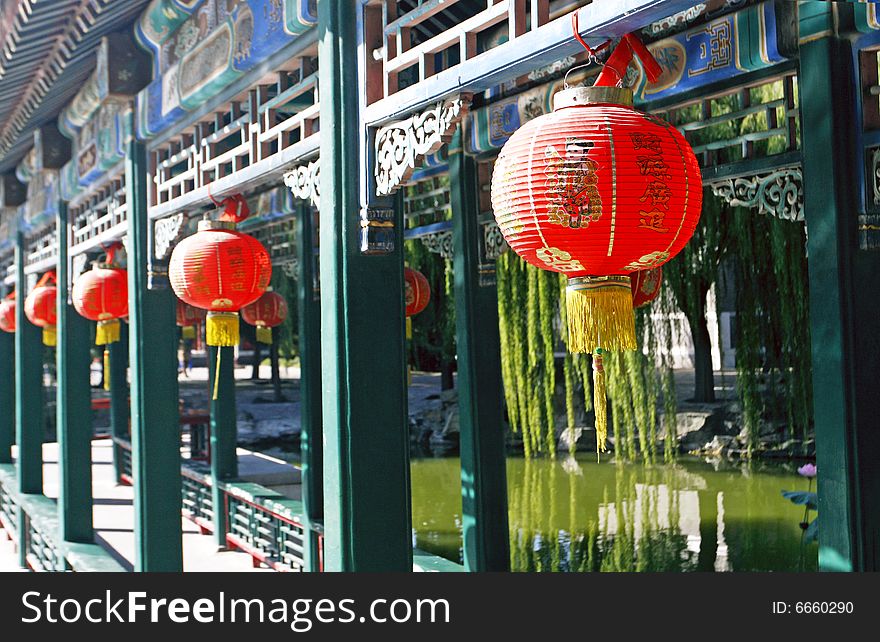 Red lantern on the ancient garden long corridor of China.

Chinese on the lantern is that a good luck is lucky.