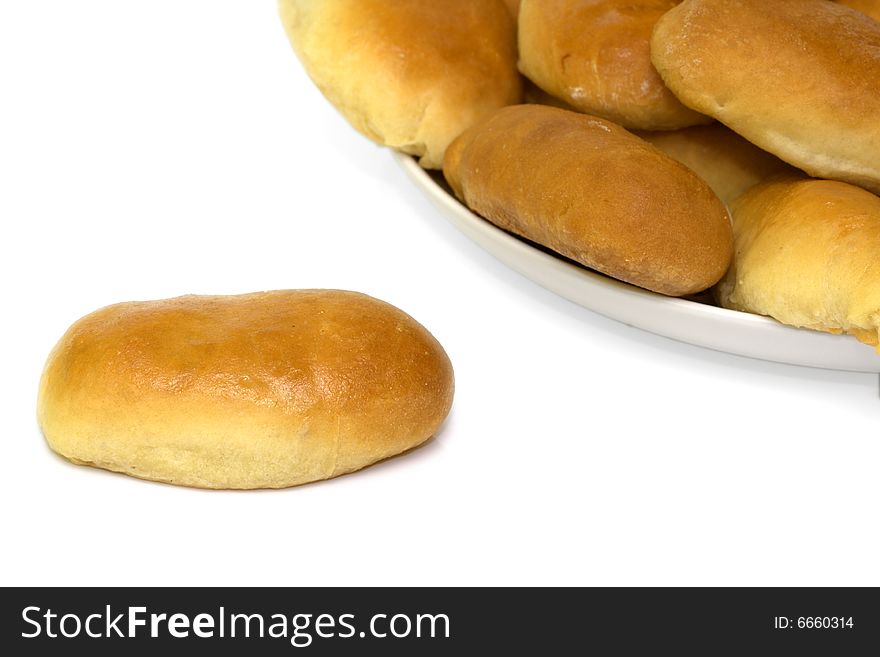Freshly baked patties isolated over white