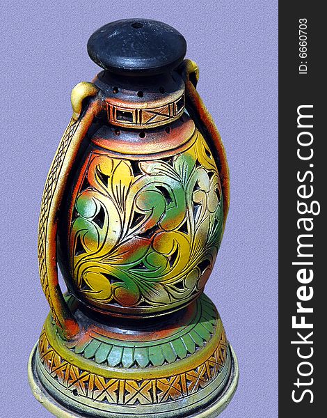 This beautiful, colorful lantern is made from clay. This beautiful, colorful lantern is made from clay.