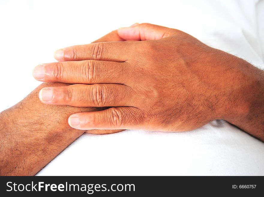 African american male hands resting on his chest. African american male hands resting on his chest.