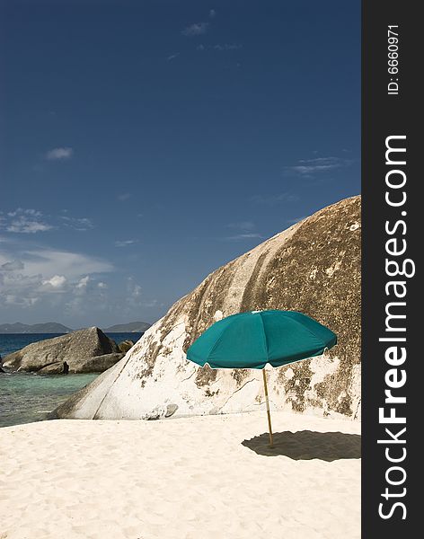 Single green umbrella on tropical beach. Single green umbrella on tropical beach