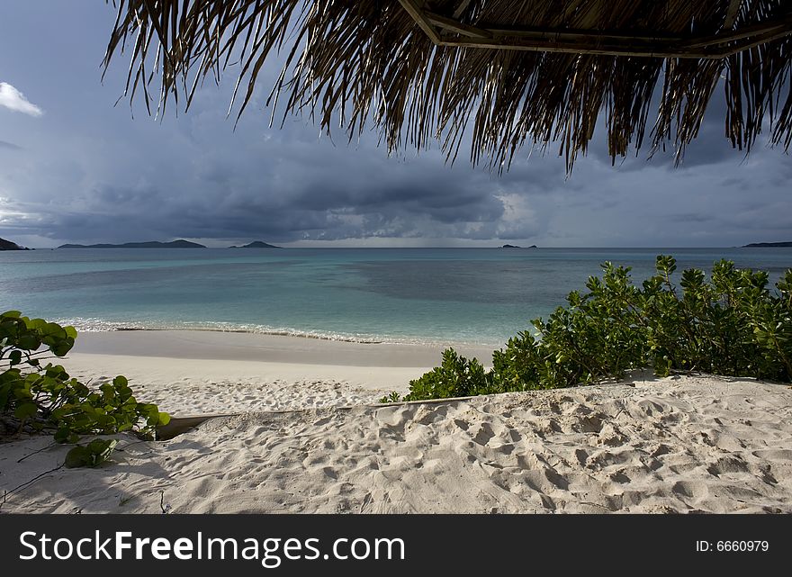 Storm clouds coming towards the tranquil beach. Storm clouds coming towards the tranquil beach