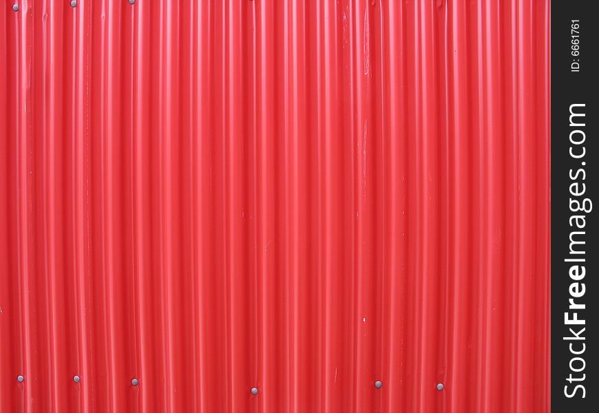 A red metal wall background