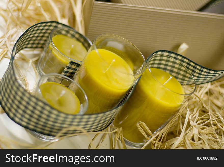 Five yellow candles, ribbon and box