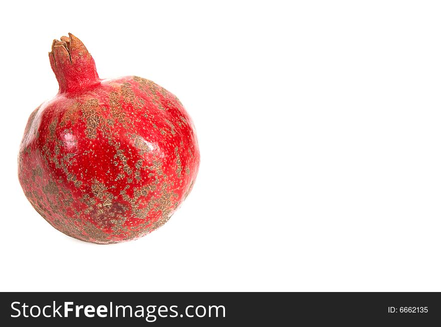 One pomegranate isolated on a white background. One pomegranate isolated on a white background.