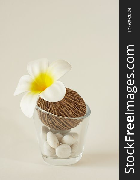 Frangipani with glass and white rock. Frangipani with glass and white rock.