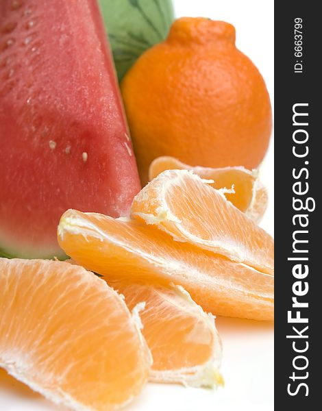 Tasty orange slices on white background with watermelon