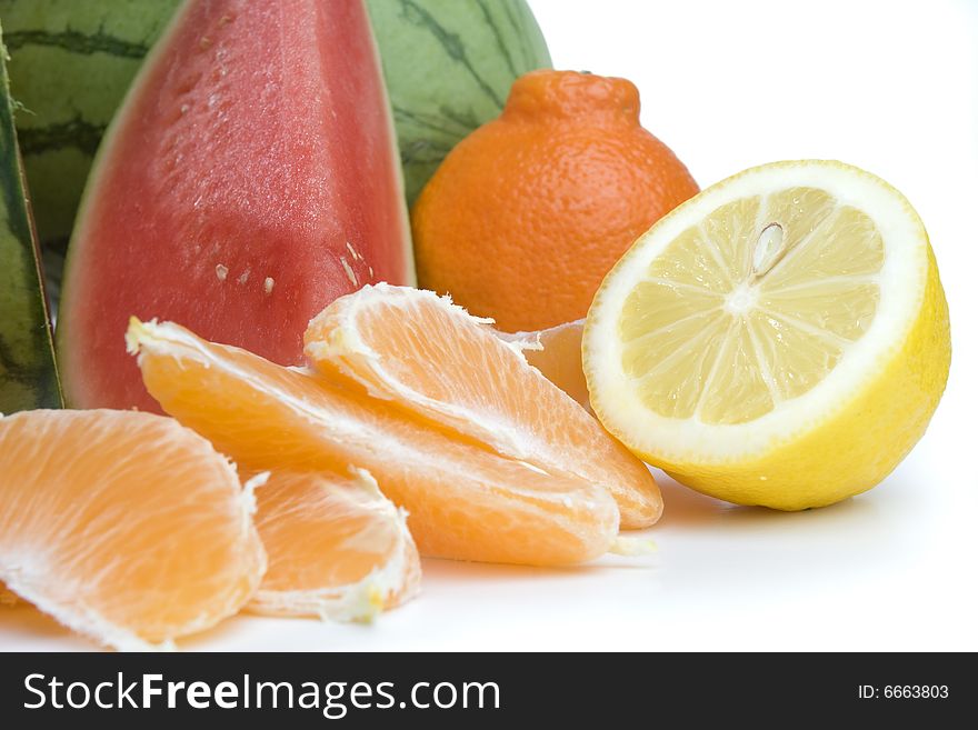 Tasty orange slices on white background with watermelon