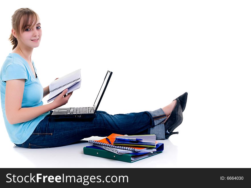 Teenager schoolgirl with laptop on white background