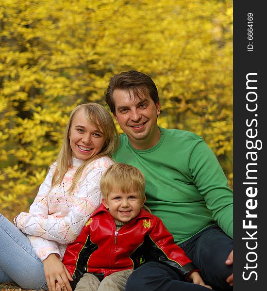 Family In Autumn Forest