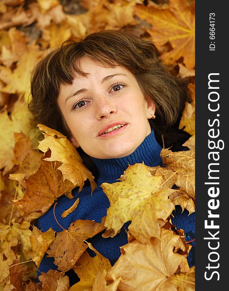 Girl and autumn leaves