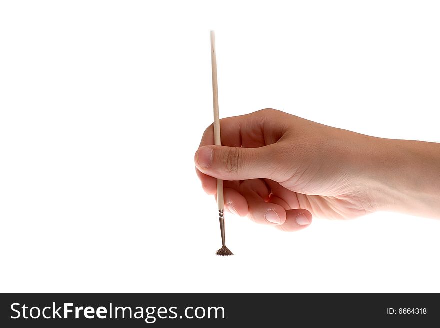 Brush in hand on a white background