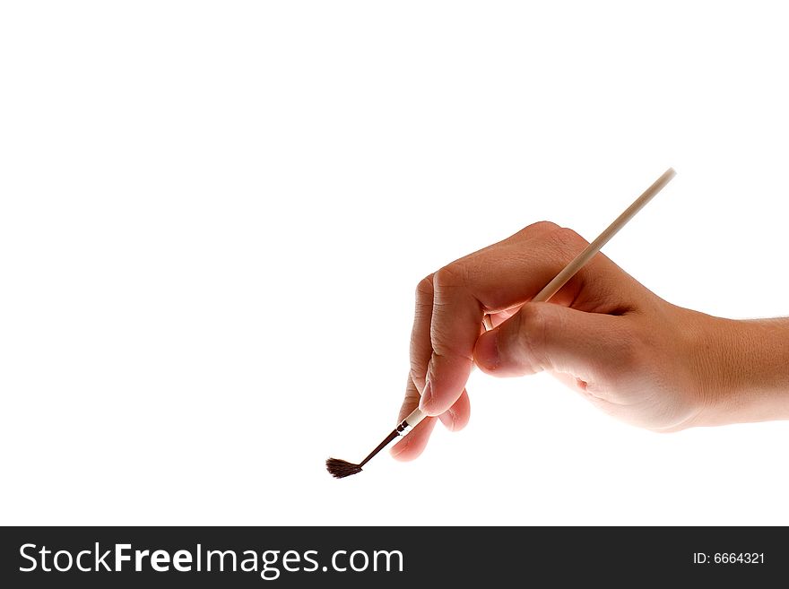 Brush in hand on a white background