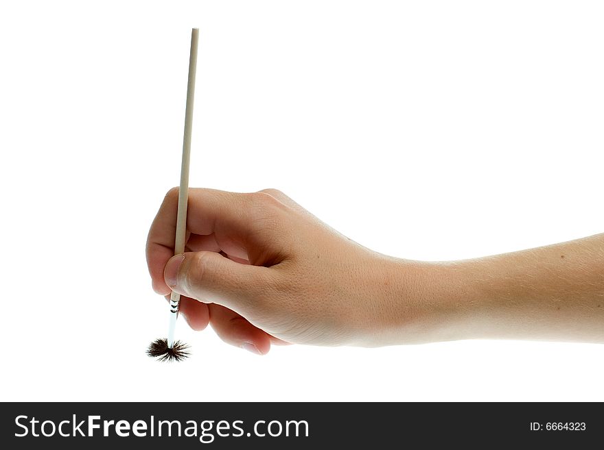 Brush in hand on a white background