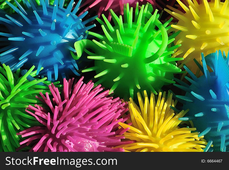 Background of colorful soft spiny rubber fish toys. Background of colorful soft spiny rubber fish toys