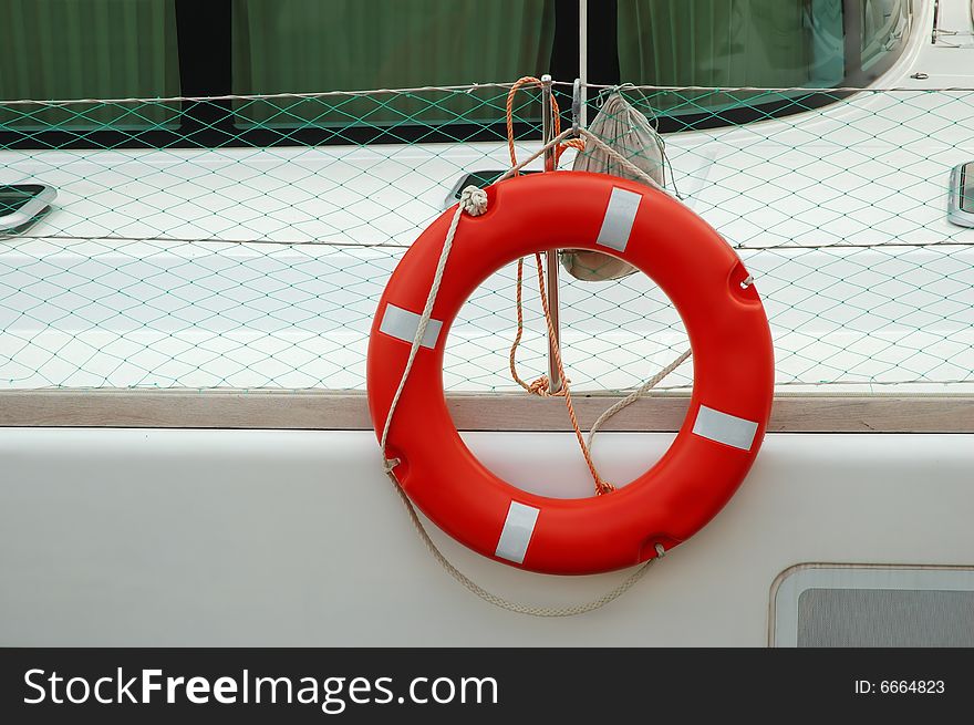 Llife-preserver ring on white yacht
