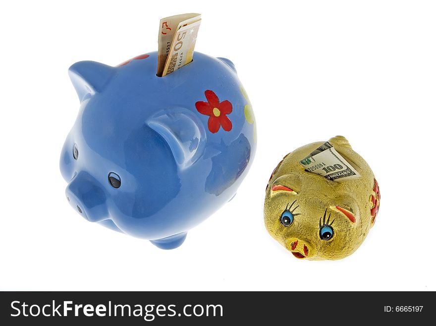 Piggy bank with dollar and euro against a white background