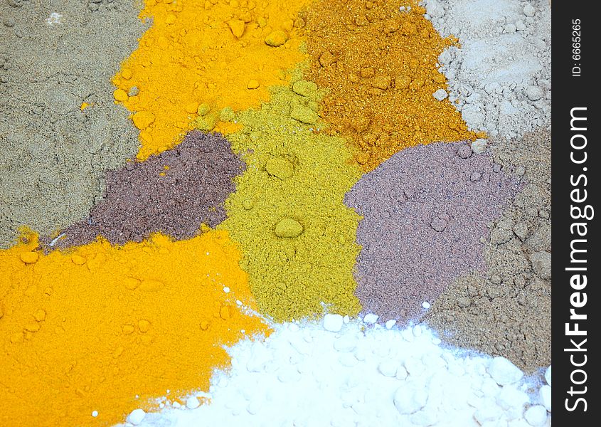 A background of different coloured spices