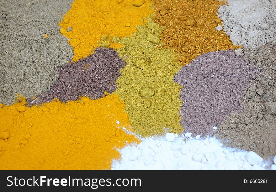 A background of different coloured spices