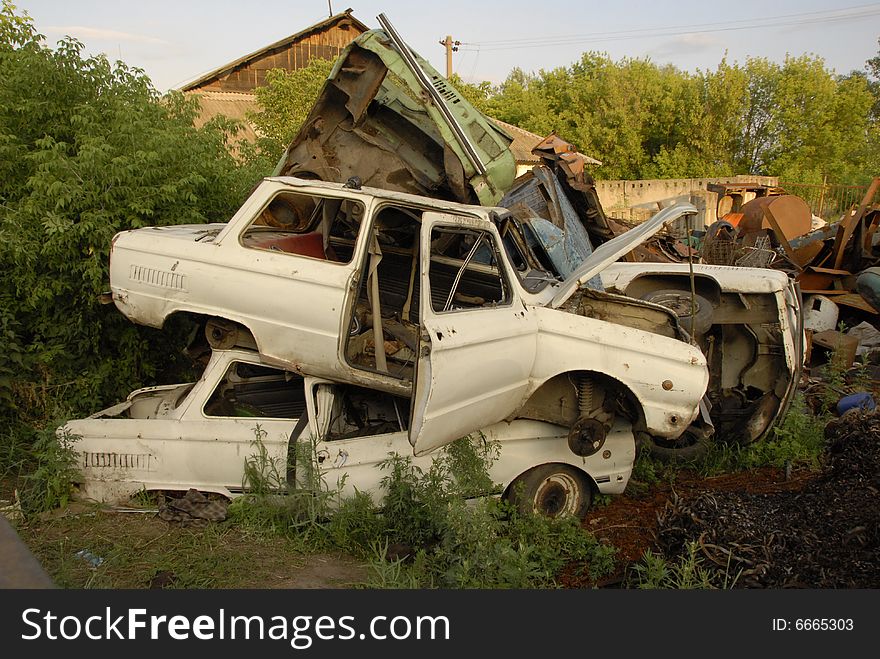 Dump with a lot of old cars on the grass. Dump with a lot of old cars on the grass