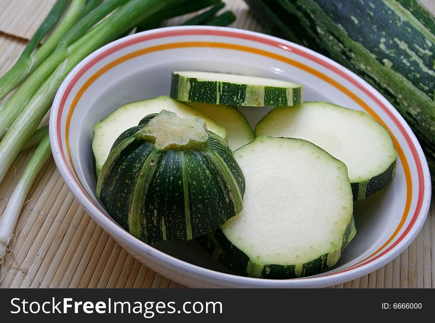 A fresh green zucchini ready for cocking